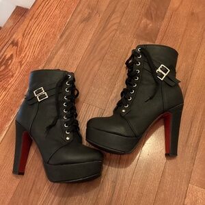 black leather heeled ankle boots. Red sole. Size 8